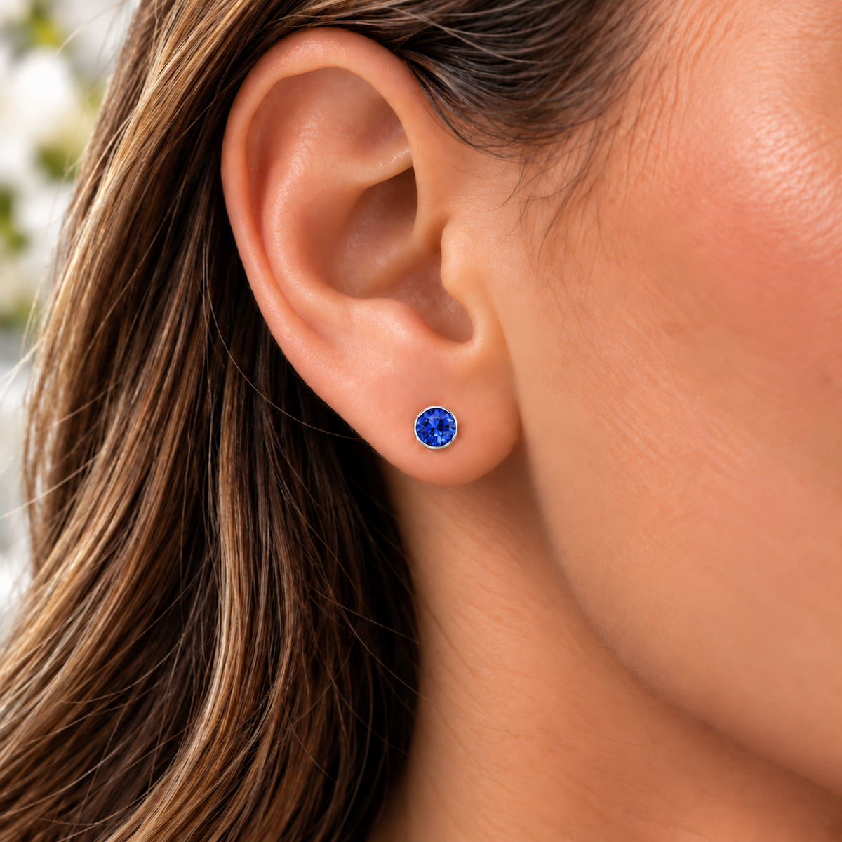 4mm September Sapphire Birthstone Stud Earrings worn by model