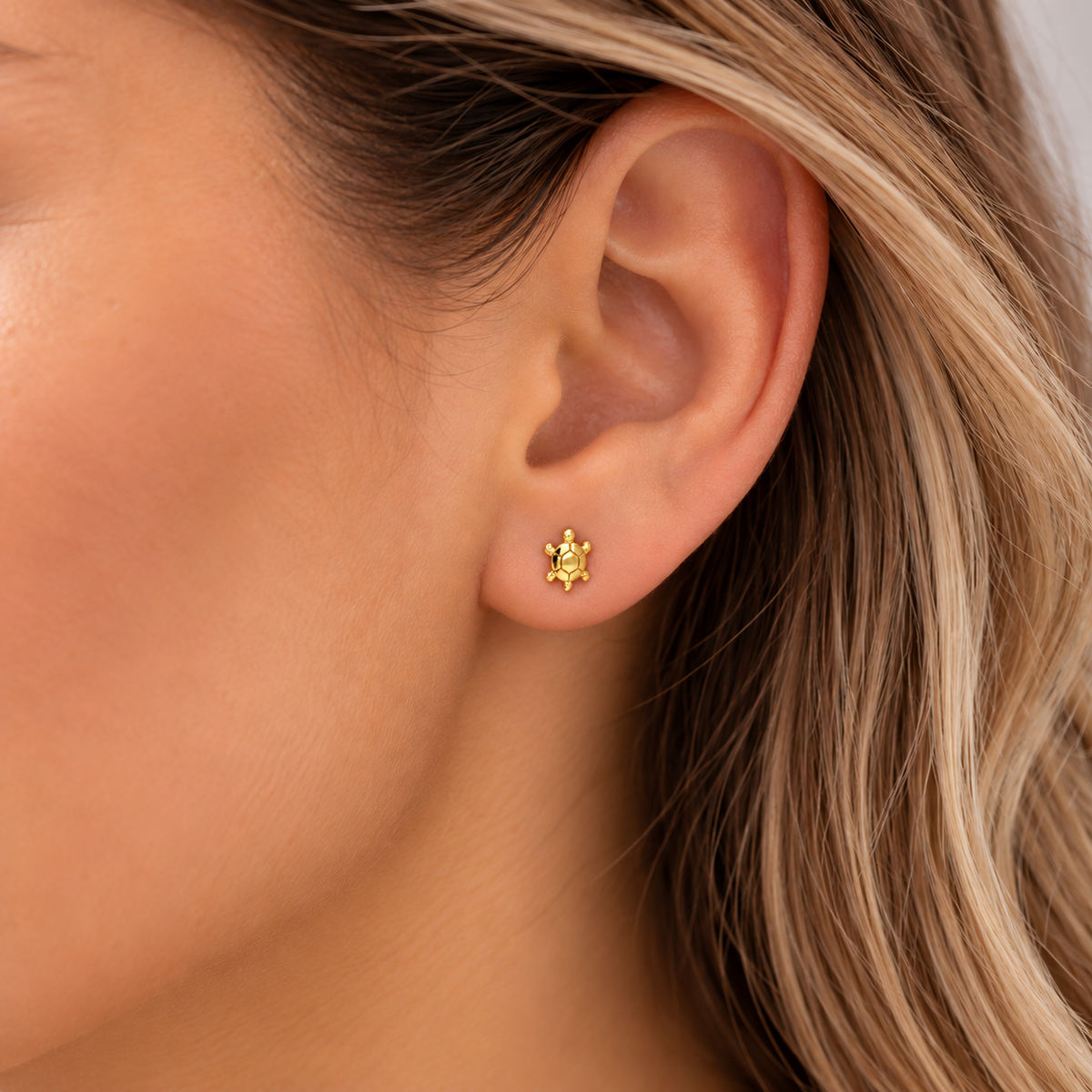 Gold Turtle Stud Earrings worn by model