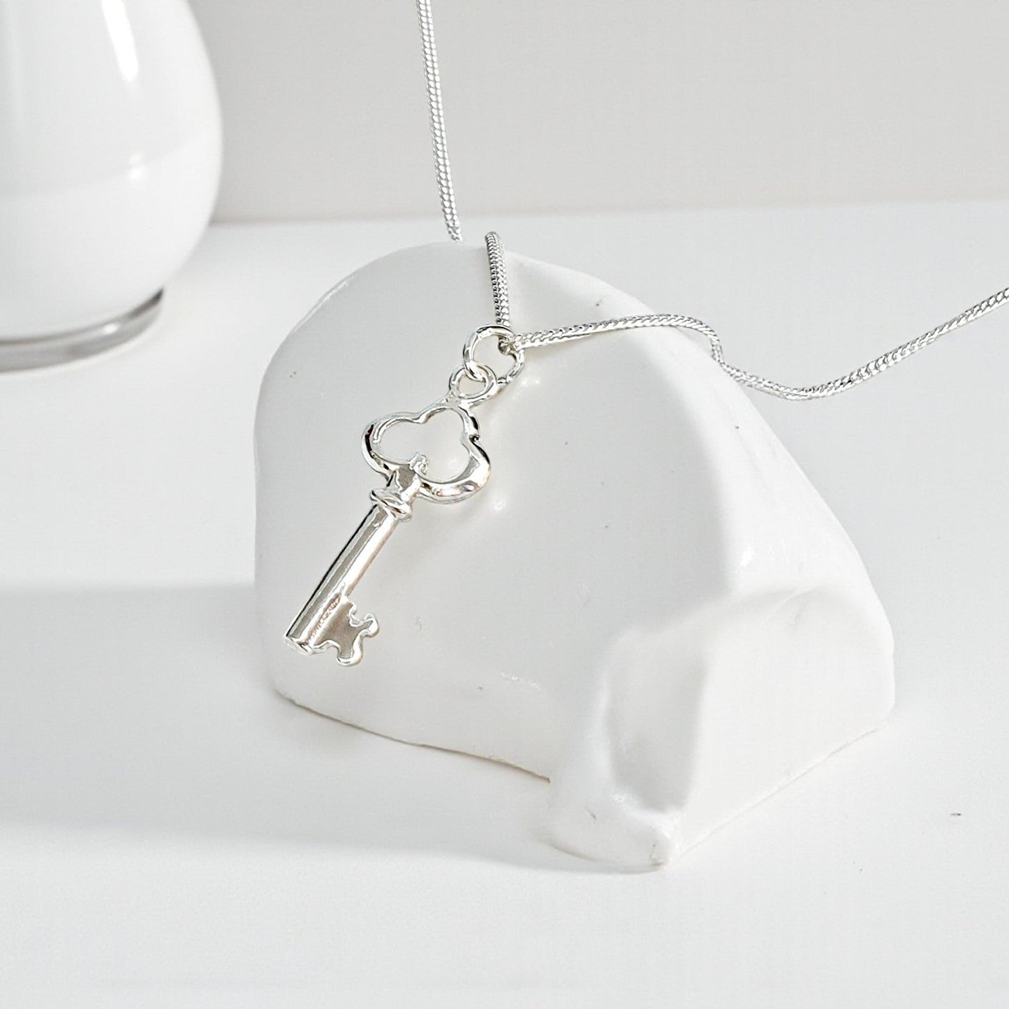 Unlock elegance and personal style with our Key Necklace, crafted in genuine 925 sterling silver. Featuring a delicate key pendant, this necklace symbolises opportunity, new beginnings, and the key to someone’s heart – making it a meaningful and stylish gift.

Perfect for birthdays, anniversaries, graduations, or as a thoughtful keepsake, this necklace pairs beautifully with other jewellery or can be worn alone as a minimalist statement piece.