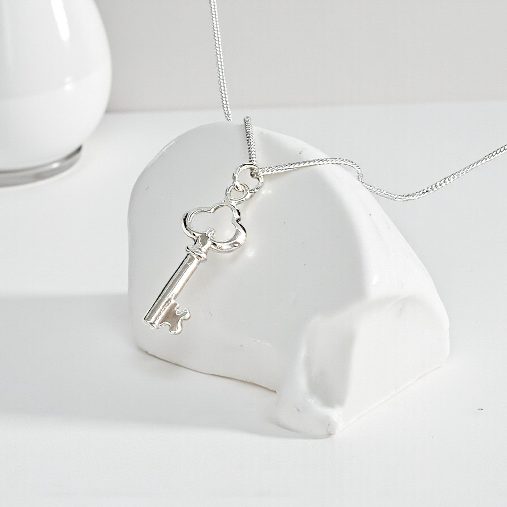 Unlock elegance and personal style with our Key Necklace, crafted in genuine 925 sterling silver. Featuring a delicate key pendant, this necklace symbolises opportunity, new beginnings, and the key to someone’s heart – making it a meaningful and stylish gift.

Perfect for birthdays, anniversaries, graduations, or as a thoughtful keepsake, this necklace pairs beautifully with other jewellery or can be worn alone as a minimalist statement piece.